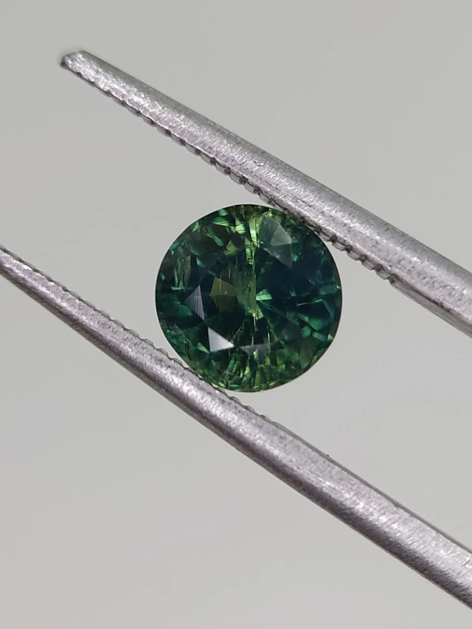1.3ct Bluish Green Natural Round Faceted Sapphire from Nigeria — view 5